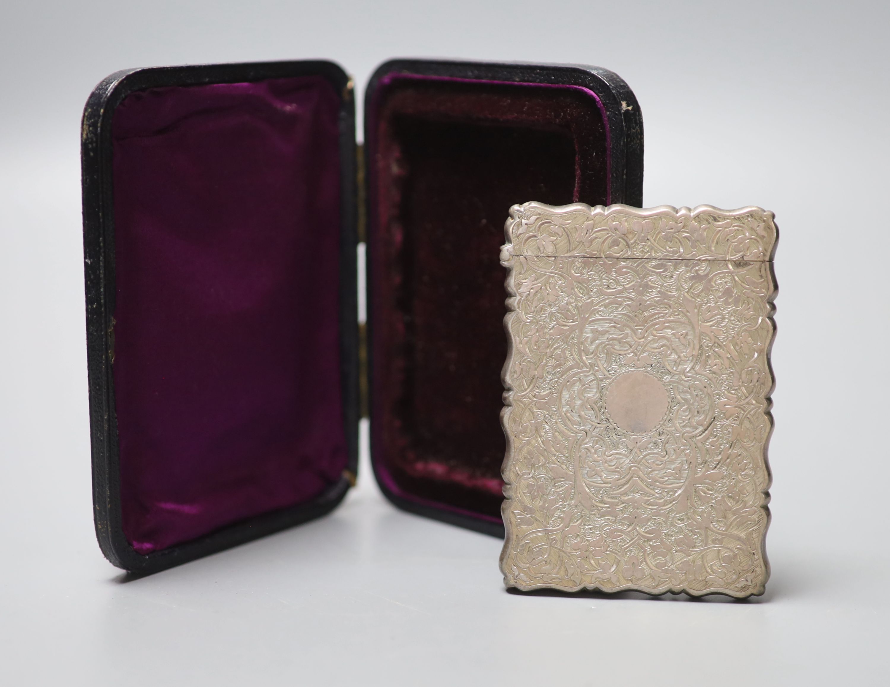 A cased Victorian engraved silver calling card case, George Unite, Birmingham 1878, 96mm.